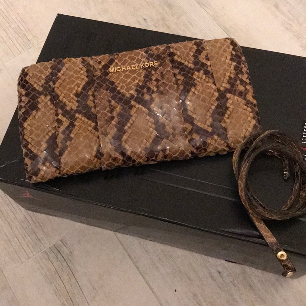 Micheal Kors clutch with strap
